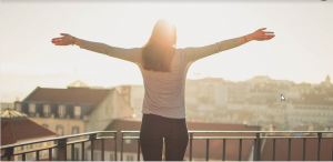 a woman facing the sunrise