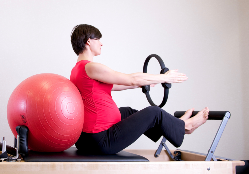 a girl exercising with a ball